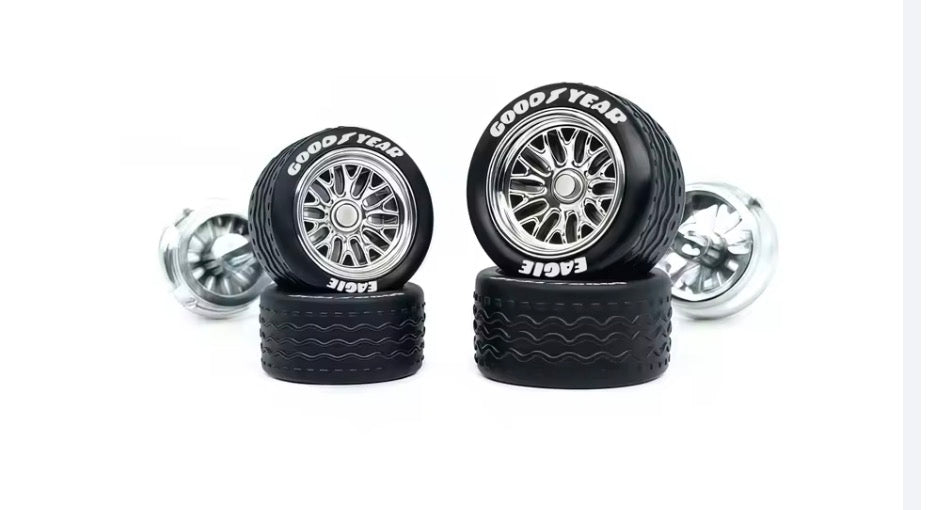 Chrome BBS style spoked wheel set staggered with white letter tires