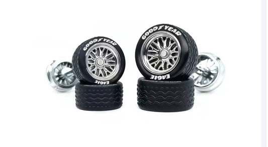 Chrome BBS style spoked wheel set staggered with white letter tires