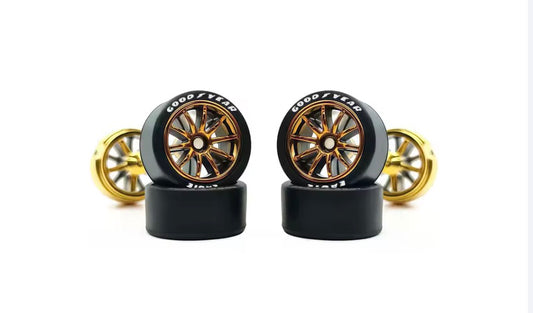 Gold spoked wheel set with white letter tires